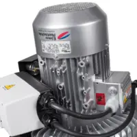 Close-up of the three-phase motor and side-channel blower mounted on the Depureco TB industrial vacuum.