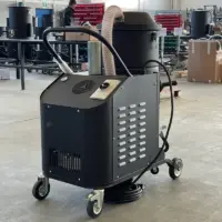 Rear view of the TB UP 3 industrial vacuum showing its enclosed side-channel blower, control panel, vents, and mobile frame.