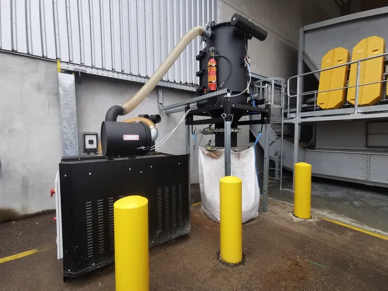 Depureco CVS central vacuum system discharging collected material into a bulk bag at an outdoor industrial facility.