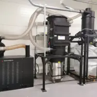 Depureco CVS central vacuum system with DV AIR 800 separator, vacuum power unit, removable collection bin, and bulk bag station.