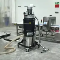 Depureco ECOBULL T22 industrial vacuum positioned beside food-processing and inspection equipment.