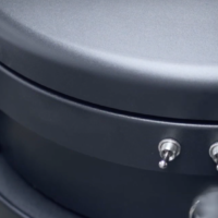 Close-up of the M100 JC JetClean filter-cleaning controls mounted on the upper vacuum housing.