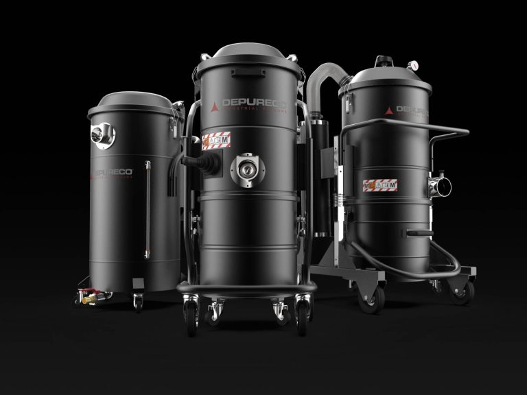 Three Depureco pneumatic (compressed-air) industrial vacuums on wheeled frames, one with a coiled hose, studio backdrop.
