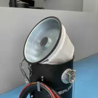 Open WD 132 industrial vacuum showing the internal wet and dry filter beneath the removable top lid.