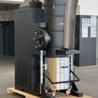 Depureco DF FIX stationary industrial vacuum system with large stainless steel collection container and high-capacity suction hose.