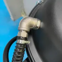 Corrugated hose elbow connection on the Depureco WD AIR pneumatic industrial vacuum.