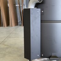 Side-mounted airflow duct, upper outlet elbow, and lower flexible hose on a Depureco trims and scraps pre-separator.