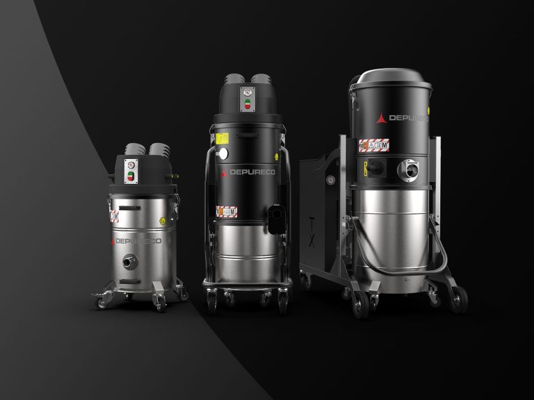 Three Depureco explosion-proof/ATEX Z22 industrial vacuums on wheeled frames in a studio lineup.