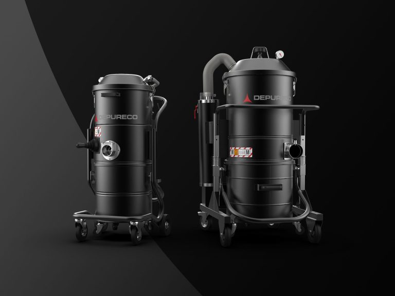 Two Depureco pneumatic (compressed-air) industrial vacuums for fine dust on wheeled frames; one with coiled hose, studio backdrop.